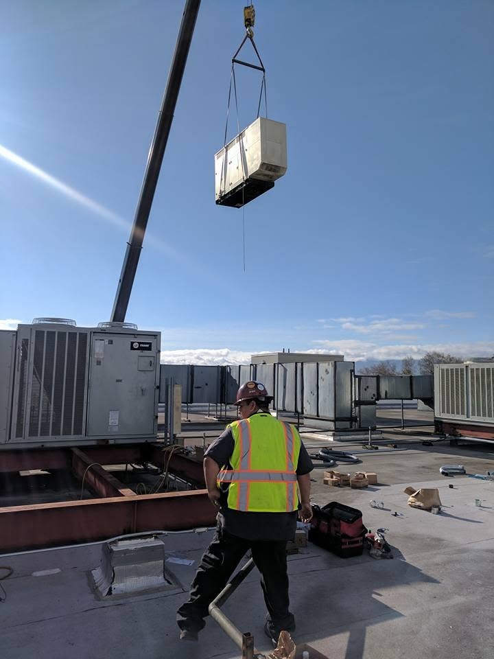 Silver Creek Electric crew installing rooftop equipment on a commercial project